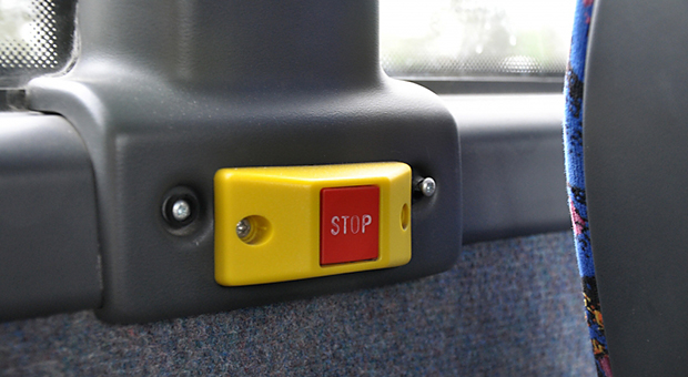 Bild av en stoppknapp i en buss